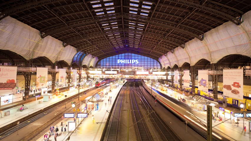 HAMBURG, Sept 6, Hamburg Main train station timelapse where people can be seen boarding trains and trains move in and out of platforms. September 6, in Hamburg, Germany