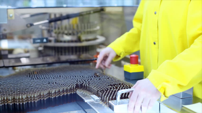 Automatic optical inspection machine, inspects vials and ampoules for particulates in liquid and container defects.