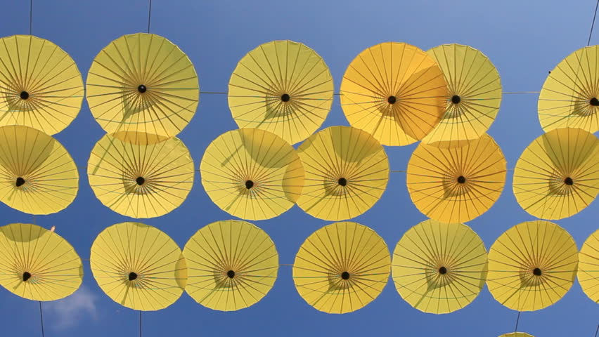 yellow umbrellas against a bright blue sky