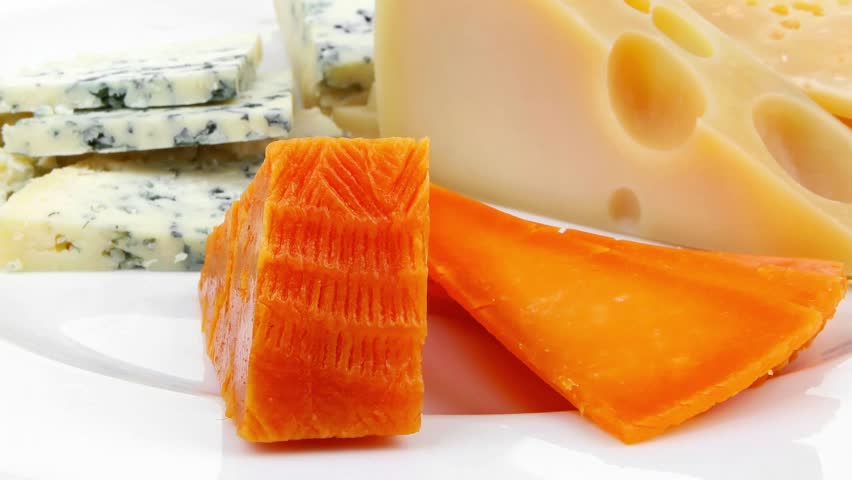 french delicatessen aged cheeses chops served on white plate with slices hidef slow motion intro