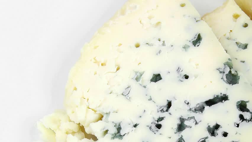 french delicatessen aged cheeses chops served on white plate with slices hidef slow motion intro