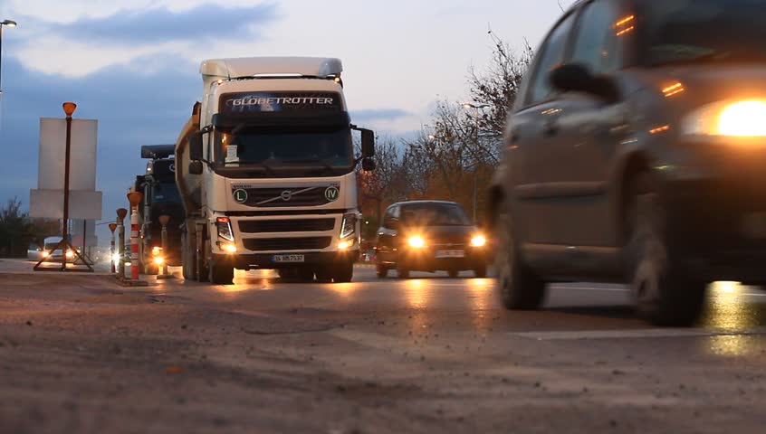 ISTANBUL - DEC 30: Heavy duty dump trucks work for formation of new land by filling the sea at Maltepe on December 30, 2012 in Istanbul, Turkey. Camions running to haul such things as gravel or rock