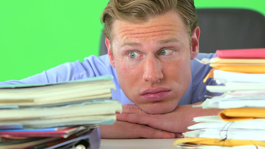 businessman distressed over paperwork on greenscreen