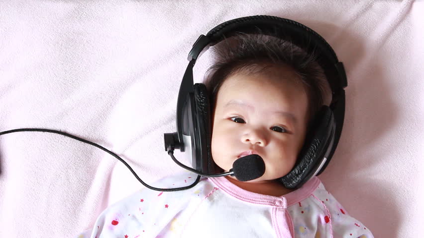 Baby enjoying to listen song