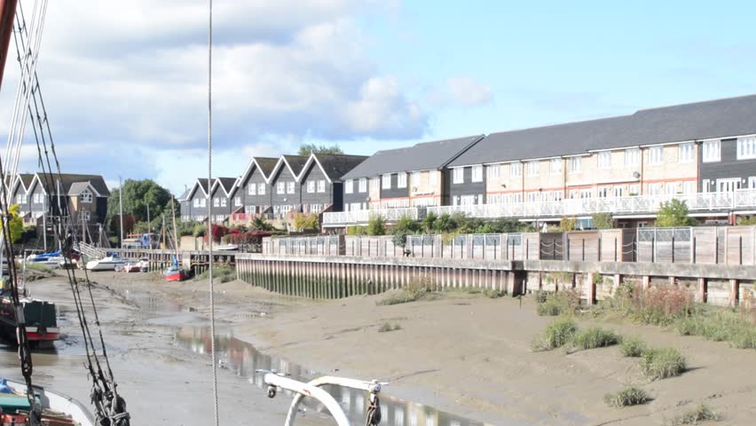 FAVERSHAM, UNITED KINGDOM - 6 October 2011: Boats in one of the Canals of the Thames River leading to the North Sea in Faversham, UK. These Canals are subject to changes in water levels due to the tide. 