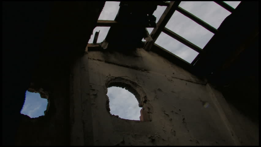 Time-lapse of the sky through the broken roof of an abandoned building.