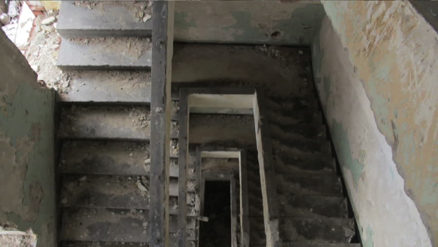 Ominous crane shot over an abandoned staircase.