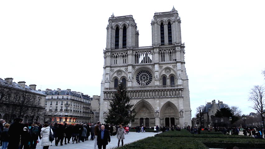 PARIS, FRANCE - DECEMBER 26, 2011 Tourists visit Notre Dame Cathedral in Paris, France, Our Lady Church, French Architecture
