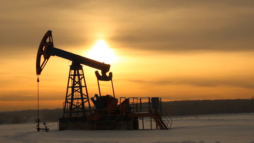 Oil production. Oil pumps at sunset 