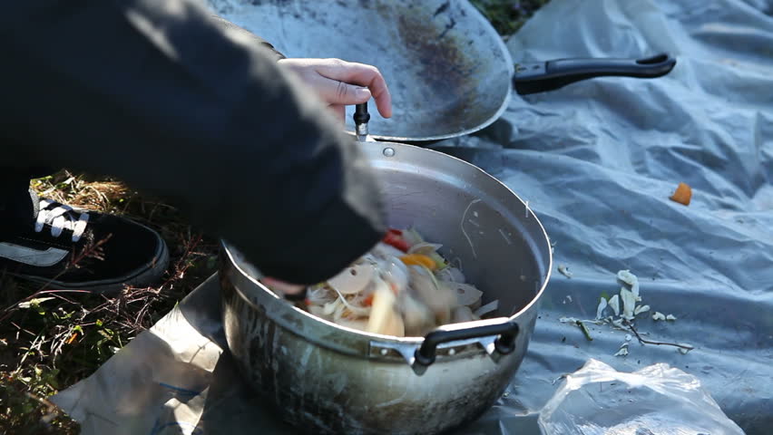 Cooking Spicy salad oudoors. camping trip. 