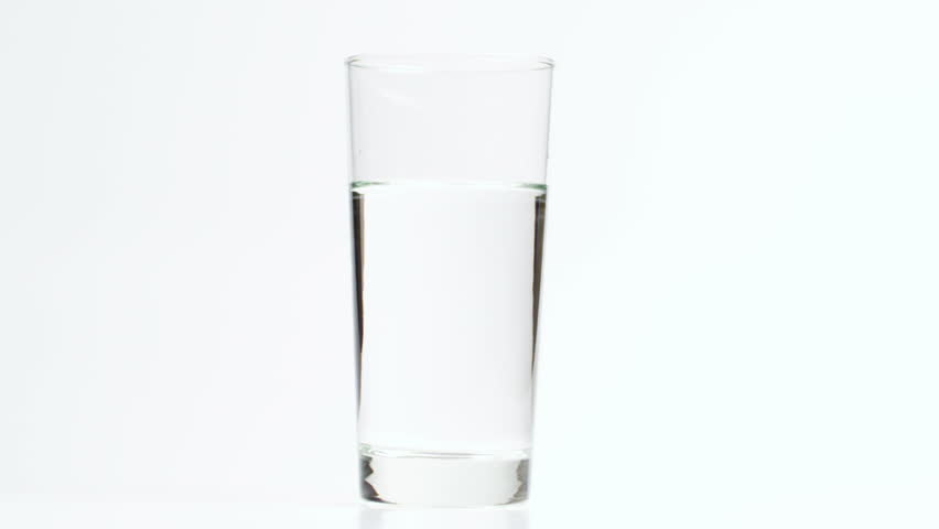 Making a Refreshing Drink with Lime and Ice