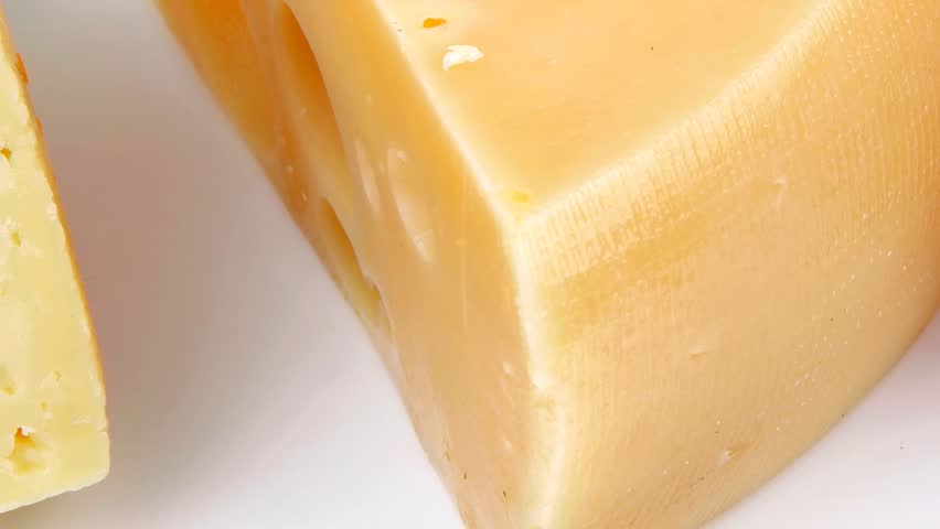 french delicatessen aged cheeses chops served on white plate isolated over white background
