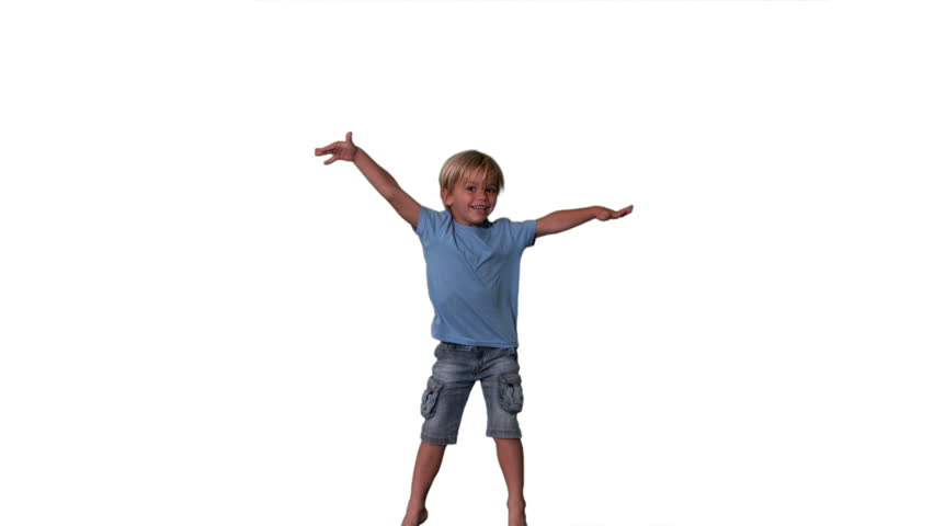 Boy in denim shorts jumping on white background in slow motion