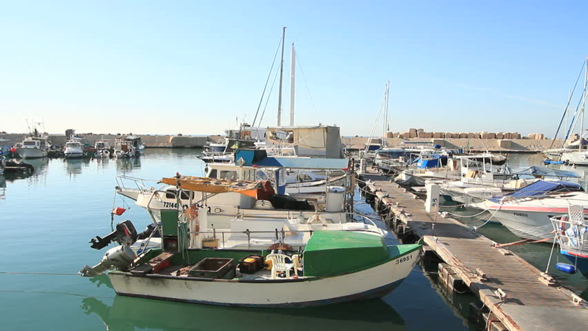 long shot of boats being anchored at Jaffa port