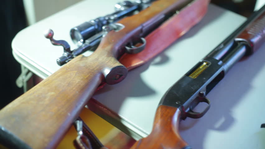 Guns at a gun show. 
Studio area, fake setup