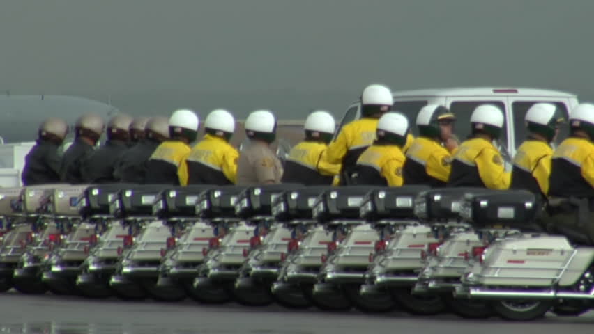 SALT LAKE CITY - CIRCA 2010: Defense escort lines up to Presidential limo