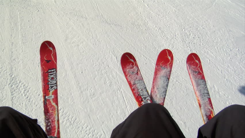 UTAH - CIRCA 2010: Shot of skis on chairlift, snowy hill below