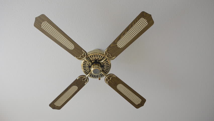 switching on an electric fan on the ceiling