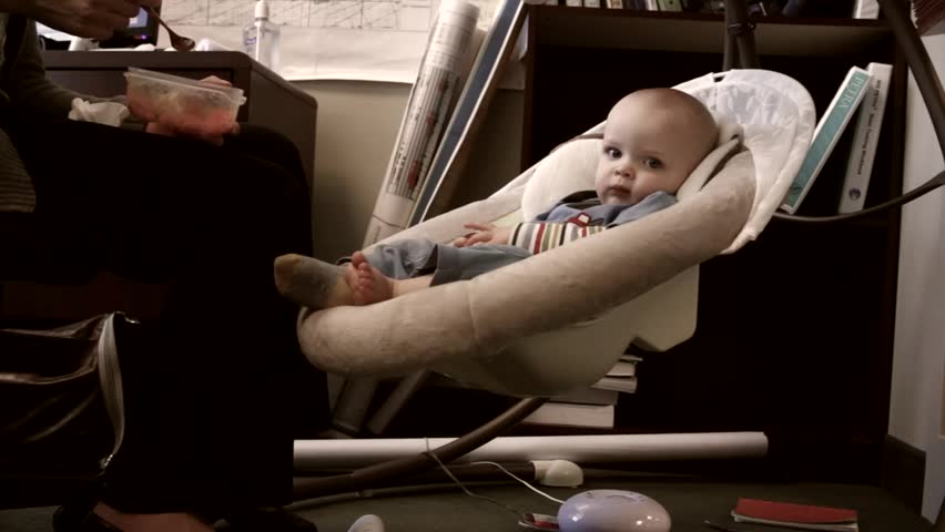 A woman working as a geologist while also taking care of her baby boy