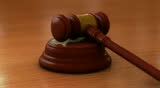 Wooden gavel that is commonly seen in courtrooms bring struck down twice when a judge has issued a statement. The gavel is struck twice before being placed back down onto the block.