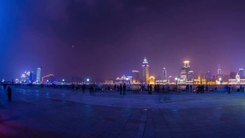 SHANGHAI - CIRCA 2013: Time Lapse of Crowds traffic across from The Bund with flying lantern in Shanghai, China