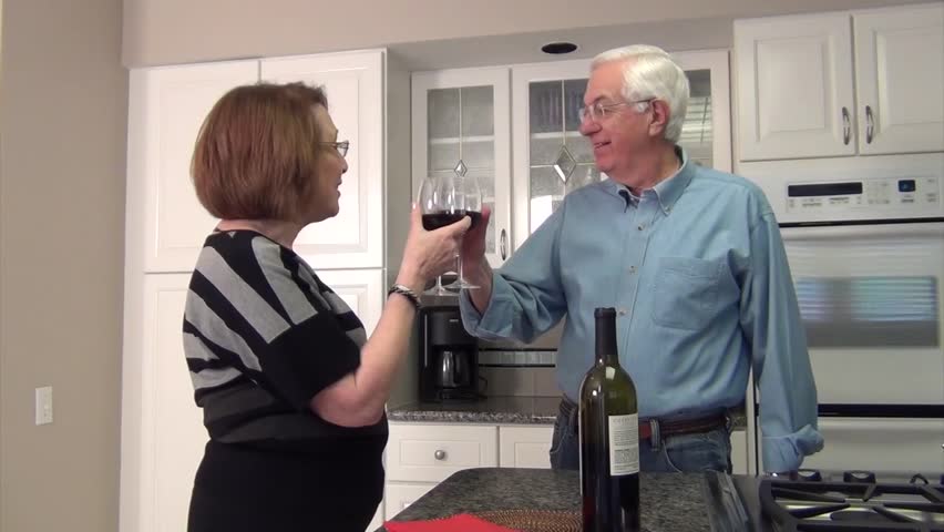 Couple in a Midwestern town making a toast together, sealed with a Kiss
