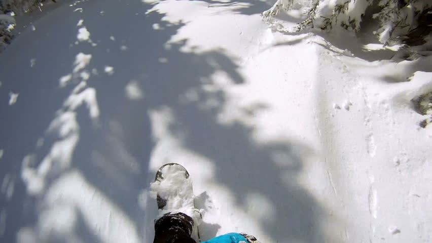 Snowboarder riding powder