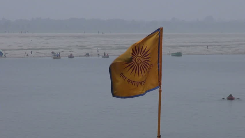 hinduism ceremony flag on Ganges river coast in Varanasi,India