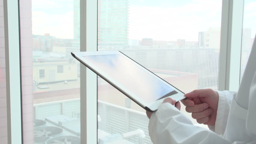 Doctor on his tablet