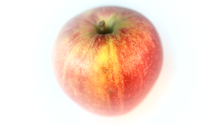 A rotary juicy red apple on a white background