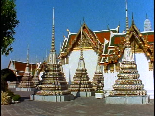 Temple of the Reclining Buddha, very wide shot, spires, pan right