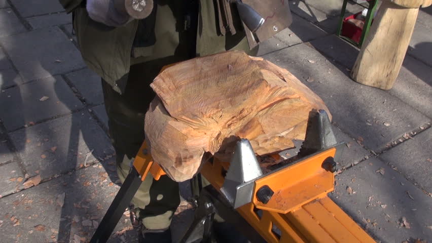 craftsman carver in agriculture fair carving wood object
