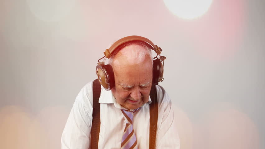 a very funky elderly grandpa dj mixing records
