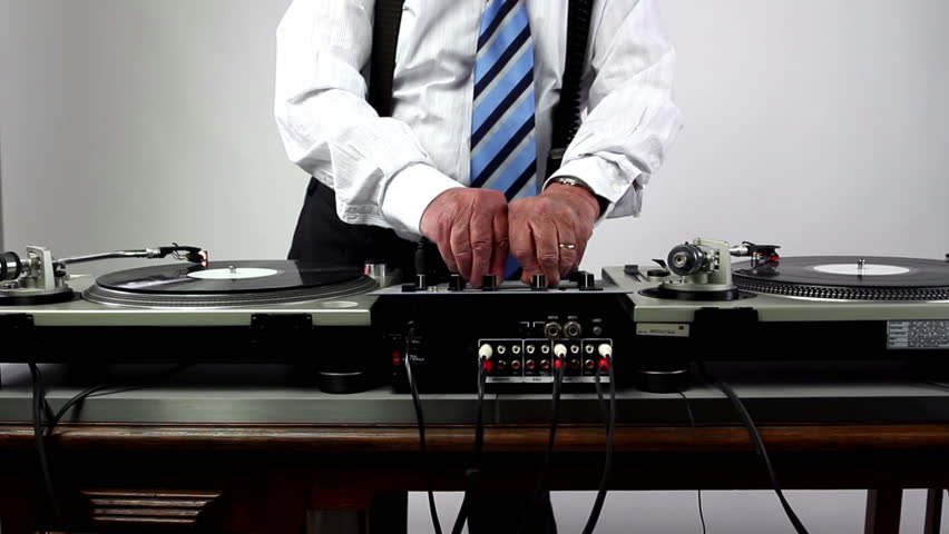 a very funky elderly grandpa dj mixing records
