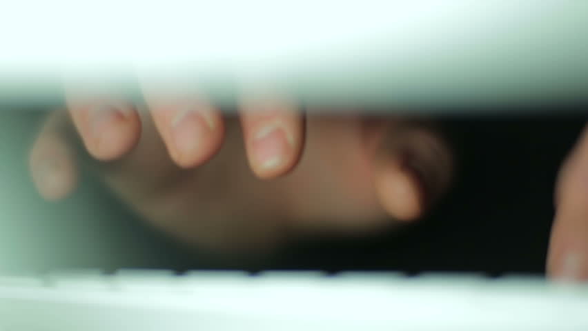 Hands typing on keyboard