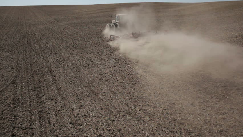 Tractor Harrowing a Field Aerial view