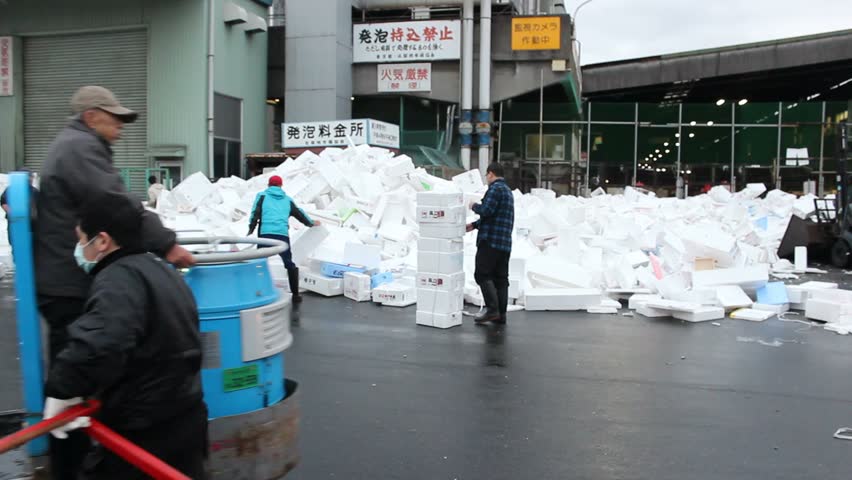 TOKYO - CIRCA MARCH 2013: A forklift plows through discarded styrofoam boxes at the Tsukiji fish market in Tokyo.