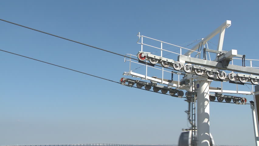 Cable car working against blue sky