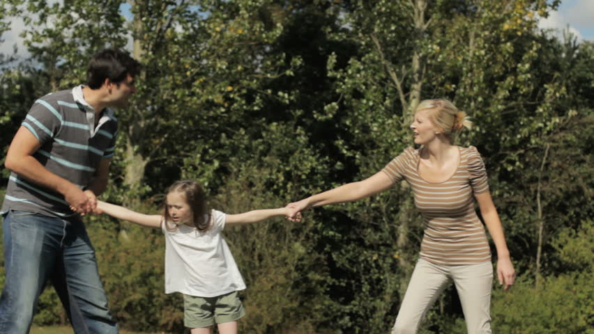 Child Custody - Tug-of-war concept, with child helpless in the middle of her angry parents