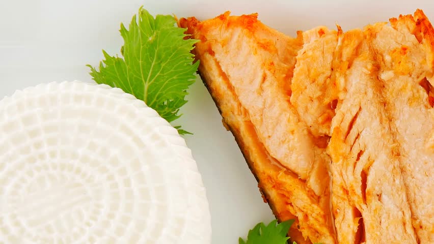 grilled salmon and tomatoes on white plate