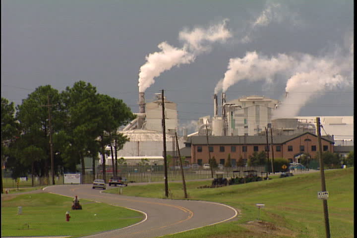 CONVENT, LOUISIANA - SEPTEMBER 4, 1999: Smokestacks spewing smoke from Convent oil refinery and IMC Agrico Chemical Company.