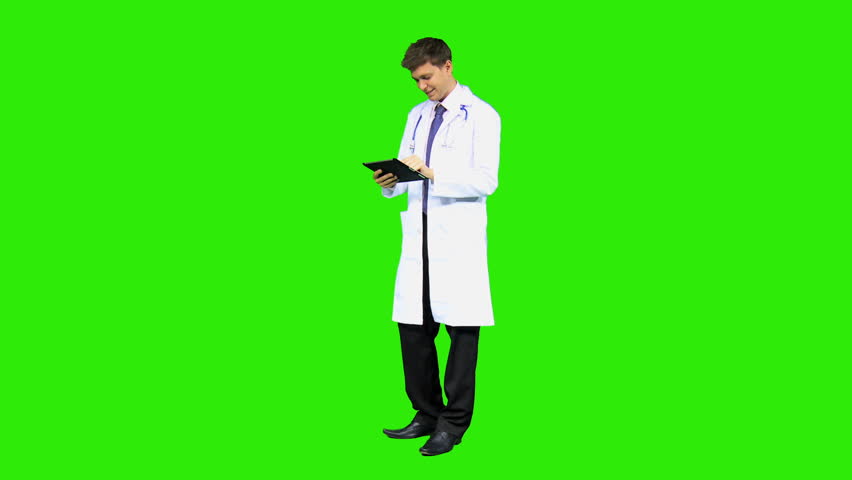 Male Caucasian junior hospital doctor wearing white coat stethoscope wireless touch screen tablet background green screen