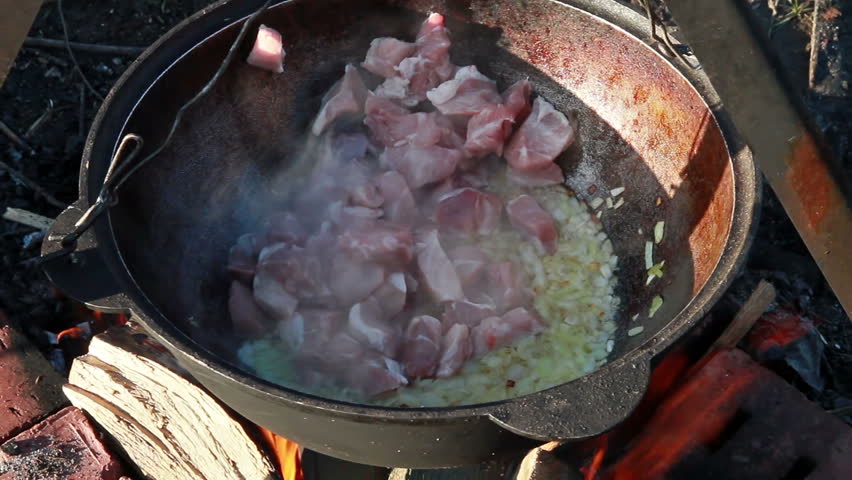 Cooking pilaf. Mix the meat