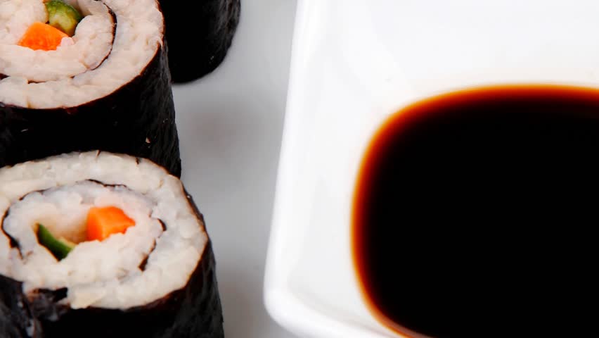 Japanese traditional Cuisine - Roll with Cucumber Cream Cheese with raw Tuna(maguro) and Salmon(sake) inside. dish with sticks 1920x1080 intro motion slow hidef hd