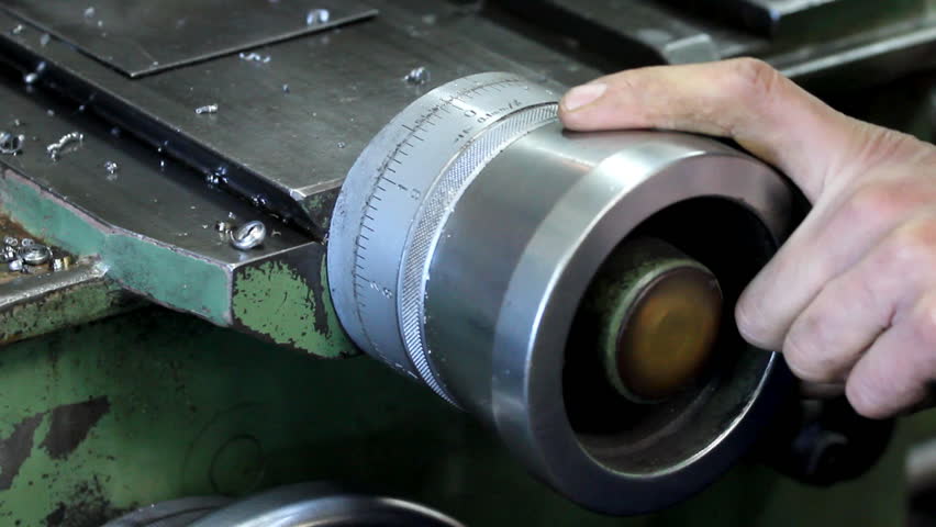 Hands on offset - Turner adjusting the turn mill.

