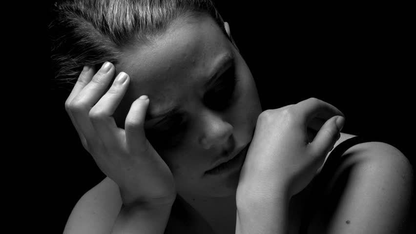 Woman in a statuesque pose in black and white. Experimental lighting. 