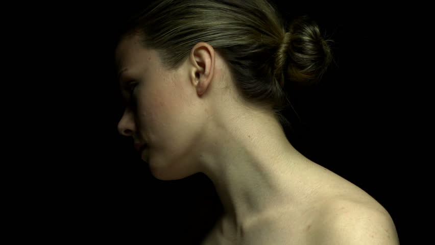 Woman facing away in color. Experimental lighting. 