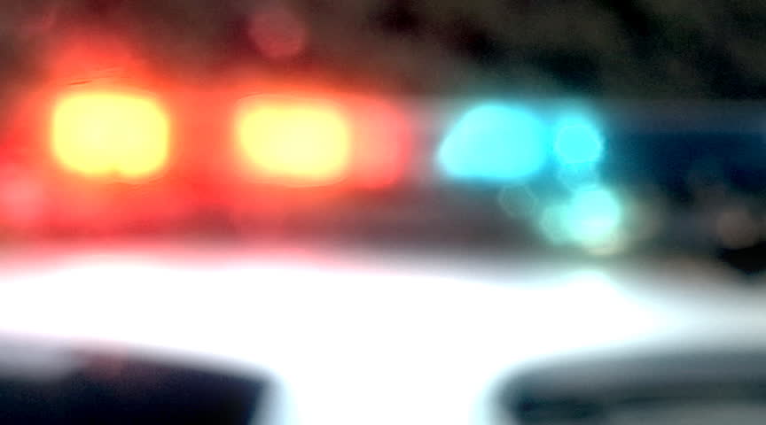 Out-of-focus flashing police car lights.