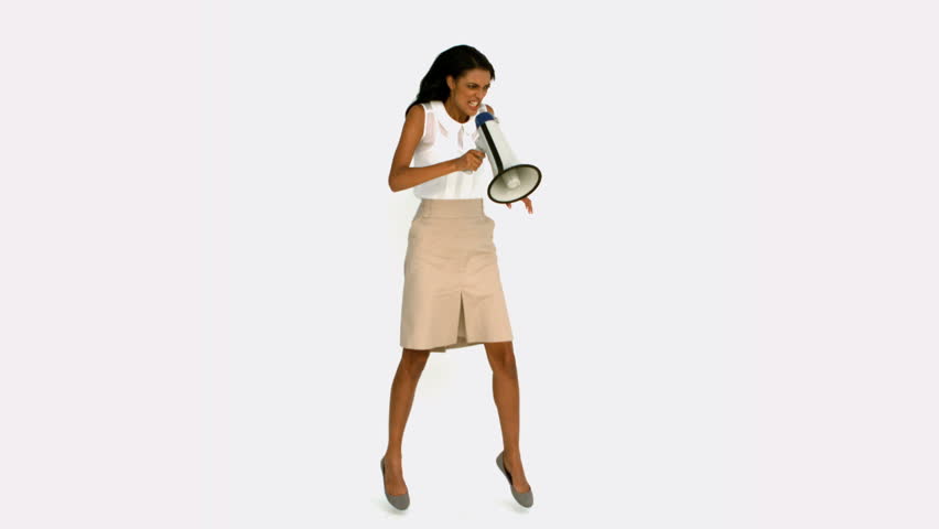Angry businesswoman shouting on megaphone in slow motion