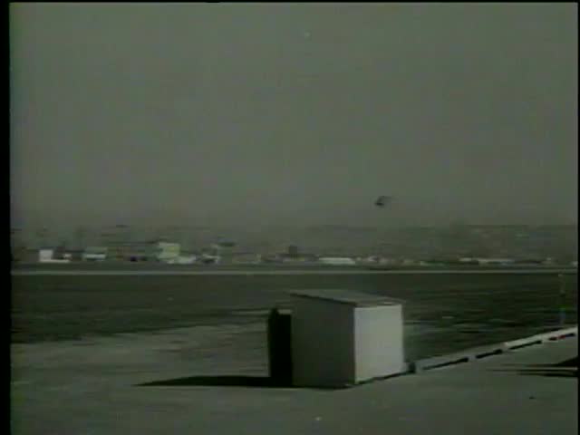 Military helicopter hovers over an airfield, Los Angeles circa 1964-MGM PICTURES, UNIVERSAL-INTERNATIONAL NEWSREEL, USA, filmed in 1964  